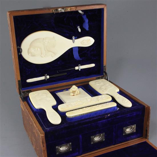 A Japanese Meiji period eight piece ivory dressing table set, 14in.